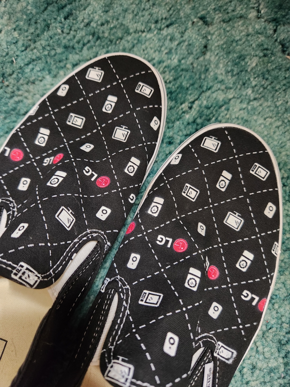 Vans Black Slip-On Sneakers with White and Red Tech Motif